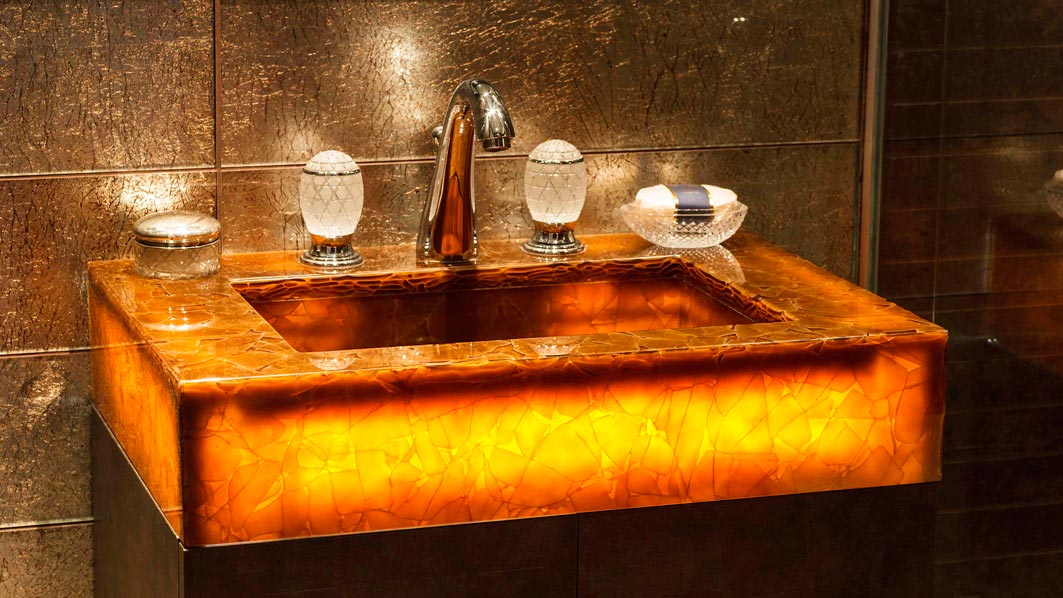 interesting basin complimented by glass basin taps