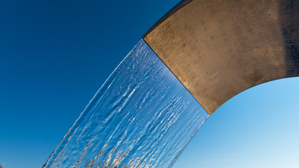 example of a waterfall jet stream, such as would be produced by a glass waterfall basin mixer